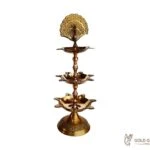 Brass peacock diya, brass peacock lamp, brass peacock diya stand, brass peacock oil lamp, brass diya for home, brass diya for temple, brass diya decoration, brass stand diya, brass diya stand, Brass Peacock Diya with Base, Diya for Pooja Room, Brass Step Peacock Diya