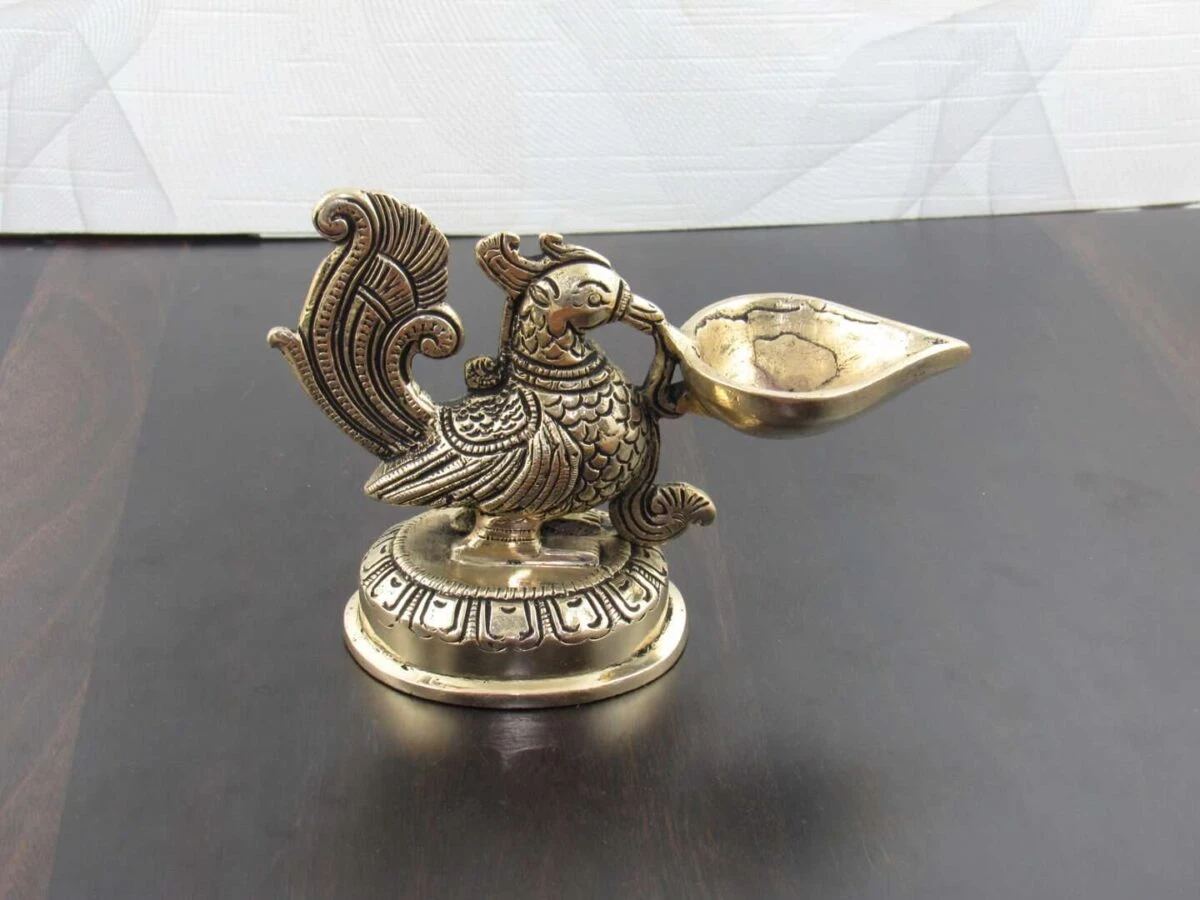 Brass peacock diya, brass peacock lamp, brass peacock diya stand, peacock brass oil diya, brass peacock statue, Brass diyas, brass diya set, brass diya stand, brass aarti diya, Brass diya for pooja, diya for pooja