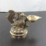 Brass peacock diya, brass peacock lamp, brass peacock diya stand, peacock brass oil diya, brass peacock statue, Brass diyas, brass diya set, brass diya stand, brass aarti diya, Brass diya for pooja, diya for pooja