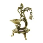 Brass peacock diya, brass peacock lamp, brass peacock diya stand, brass peacock oil lamp, brass diya for home, brass diya for temple, brass diya decoration, brass stand diya, brass diya stand, Brass Peacock Diya with Base, Diya for Pooja Room