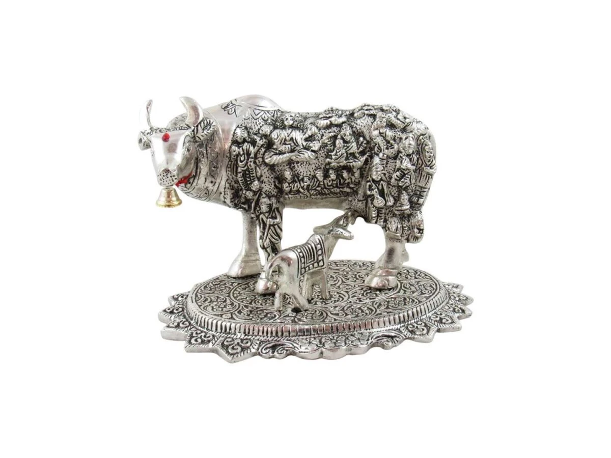 White metal cow and calf, cow and calf statue, cow and calf idol vastu, cow and calf statue in pooja room, white metal cow and calf statue, white metal small cow