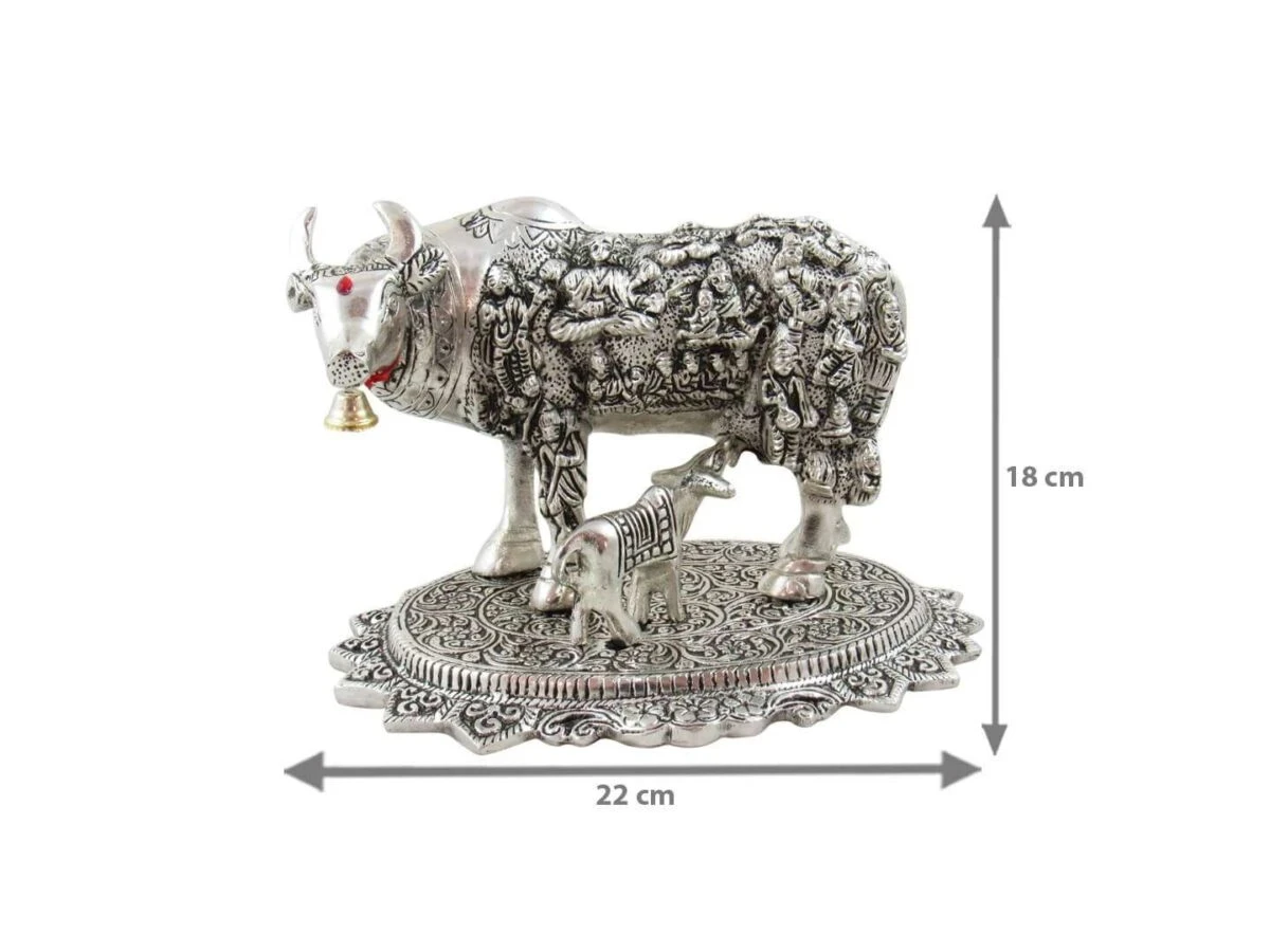 White metal cow and calf, cow and calf statue, cow and calf idol vastu, cow and calf statue in pooja room, white metal cow and calf statue, white metal small cow