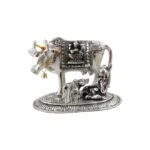 White metal cow and calf, cow and calf statue, cow and calf idol vastu, cow and calf statue in pooja room, white metal cow and calf statue, white metal small cow
