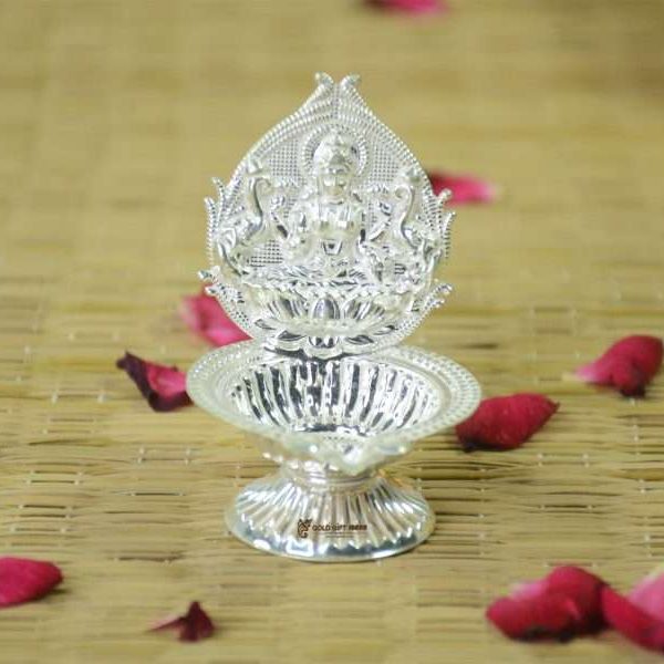 silver lakshmi diya Pure silver lakshmi diya Pure silver diya, pure silver diya for pooja, pure silver diya set, pure silver diya stand, silver diya lamp, pure silver pooja items for gift, silver items for pooja room Silver Diyas for Pooja Silver Lamps for Gifting silver gift items silver items silver gift items for marriage silver gift items for house warming silver gift articles