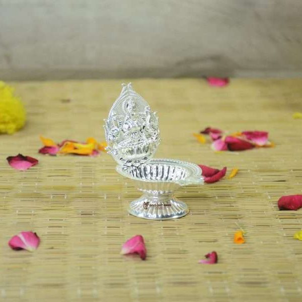 silver lakshmi diya Pure silver lakshmi diya Pure silver diya, pure silver diya for pooja, pure silver diya set, pure silver diya stand, silver diya lamp, pure silver pooja items for gift, silver items for pooja room Silver Diyas for Pooja Silver Lamps for Gifting silver gift items silver items silver gift items for marriage silver gift items for house warming silver gift articles