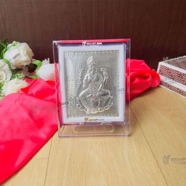 Lakshmi photo frame, silver lakshmi frame, silver lakshmi photo frame, silver laxmi frame silver gift items return gifts for housewarming silver pooja items silver gift articles Lakshmi photo frame, lakshmi devi photo frames, goddess lakshmi photo frame, lakshmi frame with charan paduka, mahalaxmi photo frame, Kolhapur mahalaxmi photo frame, return gifts for Diwali, photo frame for gift religious frame for worship, return gifts