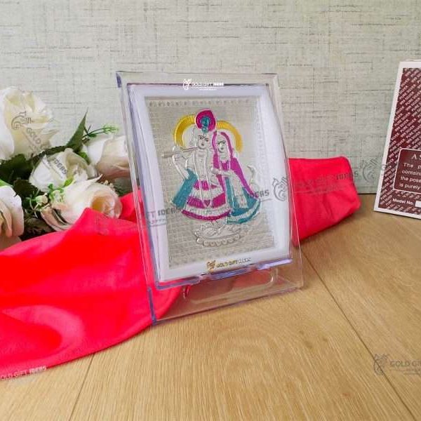 Silver Radha Krishna photo frame, radha Krishna silver frame silver radha krishna idol silver gift items return gifts for housewarming silver pooja items silver gift articles Radha Krishna photo frame, radha Krishna photo frame gift, radha Krishna wooden frame, radha Krishna frame with charan paduka, return gifts for wedding, return gifts for pooja