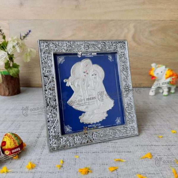 Silver Radha Krishna photo frame, radha Krishna silver frame silver radha krishna idol silver gift items return gifts for housewarming silver pooja items silver gift articles Radha Krishna photo frame, radha Krishna photo frame gift, radha Krishna wooden frame, radha Krishna frame with charan paduka, return gifts for wedding, return gifts for pooja