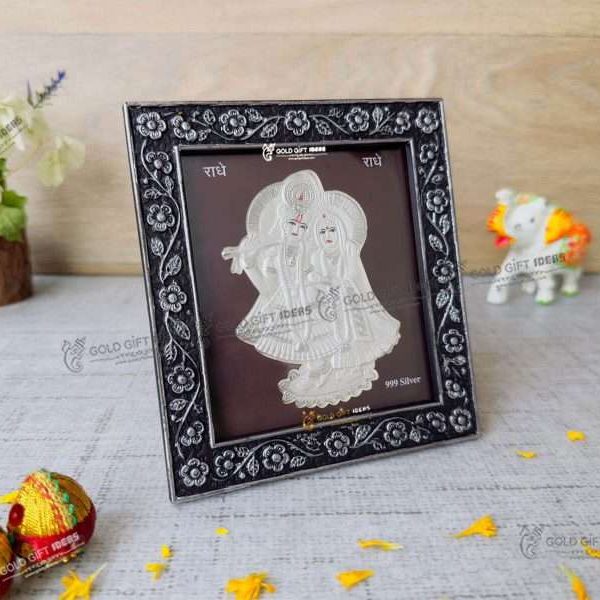 Silver Radha Krishna photo frame, radha Krishna silver frame silver radha krishna idol silver gift items return gifts for housewarming silver pooja items silver gift articles Radha Krishna photo frame, radha Krishna photo frame gift, radha Krishna wooden frame, radha Krishna frame with charan paduka, return gifts for wedding, return gifts for pooja