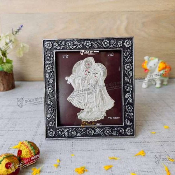 Silver Radha Krishna photo frame, radha Krishna silver frame silver radha krishna idol silver gift items return gifts for housewarming silver pooja items silver gift articles Radha Krishna photo frame, radha Krishna photo frame gift, radha Krishna wooden frame, radha Krishna frame with charan paduka, return gifts for wedding, return gifts for pooja