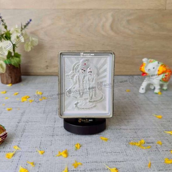 Silver Radha Krishna photo frame, radha Krishna silver frame silver radha krishna idol silver gift items return gifts for housewarming silver pooja items silver gift articles Radha Krishna photo frame, radha Krishna photo frame gift, radha Krishna wooden frame, radha Krishna frame with charan paduka, return gifts for wedding, return gifts for pooja