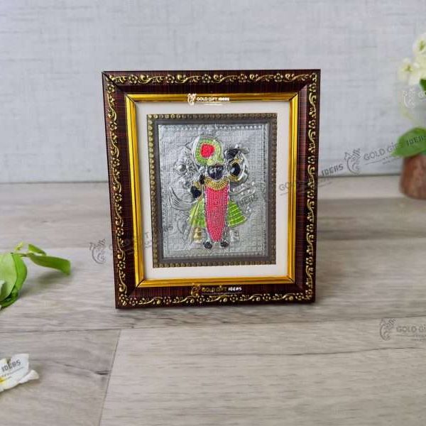 silver shreenathji frame shrinathji silver idol pure silver shreenathji photo frame Shreenathji photo frame, shreenathji photo frame nathdwara, shrinathji photo frame, shreenathji frame with charanpaduka, shreenathji photo frame for gift, return gifts for housewarming, return gifts for pooja, Wooden Momento Gift
