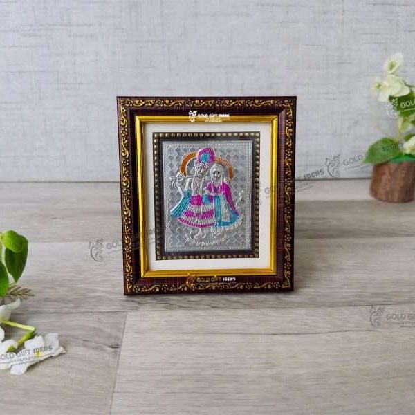Silver Radha Krishna photo frame, radha Krishna silver frame silver radha krishna idol silver gift items return gifts for housewarming silver pooja items silver gift articles Radha Krishna photo frame, radha Krishna photo frame gift, radha Krishna wooden frame, radha Krishna frame with charan paduka, return gifts for wedding, return gifts for pooja