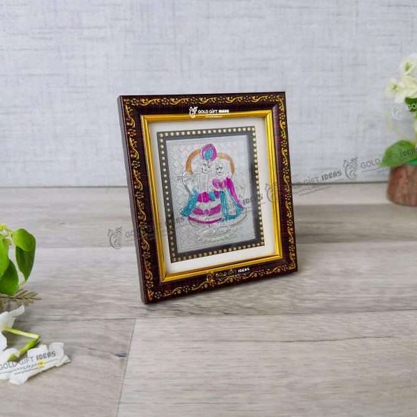 Silver Radha Krishna photo frame, radha Krishna silver frame silver radha krishna idol silver gift items return gifts for housewarming silver pooja items silver gift articles Radha Krishna photo frame, radha Krishna photo frame gift, radha Krishna wooden frame, radha Krishna frame with charan paduka, return gifts for wedding, return gifts for pooja