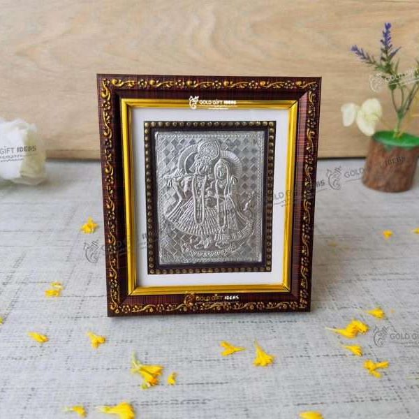 Silver Radha Krishna photo frame, radha Krishna silver frame silver radha krishna idol silver gift items return gifts for housewarming silver pooja items silver gift articles Radha Krishna photo frame, radha Krishna photo frame gift, radha Krishna wooden frame, radha Krishna frame with charan paduka, return gifts for wedding, return gifts for pooja
