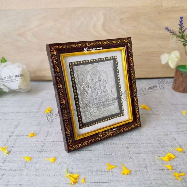 Silver Radha Krishna photo frame, radha Krishna silver frame silver radha krishna idol silver gift items return gifts for housewarming silver pooja items silver gift articles Radha Krishna photo frame, radha Krishna photo frame gift, radha Krishna wooden frame, radha Krishna frame with charan paduka, return gifts for wedding, return gifts for pooja