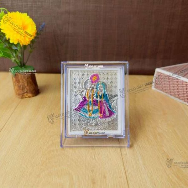 Silver Radha Krishna photo frame, radha Krishna silver frame silver radha krishna idol silver gift items return gifts for housewarming silver pooja items silver gift articles Radha Krishna photo frame, radha Krishna photo frame gift, radha Krishna wooden frame, radha Krishna frame with charan paduka, return gifts for wedding, return gifts for pooja
