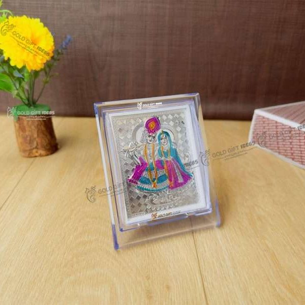 Silver Radha Krishna photo frame, radha Krishna silver frame silver radha krishna idol silver gift items return gifts for housewarming silver pooja items silver gift articles Radha Krishna photo frame, radha Krishna photo frame gift, radha Krishna wooden frame, radha Krishna frame with charan paduka, return gifts for wedding, return gifts for pooja