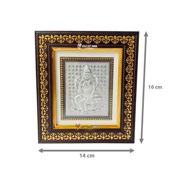 Lakshmi photo frame, silver lakshmi frame, silver lakshmi photo frame, silver laxmi frame silver gift items return gifts for housewarming silver pooja items silver gift articles Lakshmi photo frame, lakshmi devi photo frames, goddess lakshmi photo frame, lakshmi frame with charan paduka, mahalaxmi photo frame, Kolhapur mahalaxmi photo frame, return gifts for Diwali, photo frame for gift religious frame for worship, return gifts